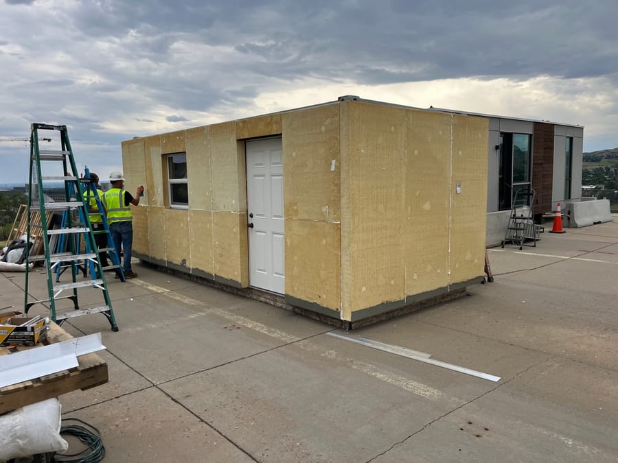 BranchRegenerate insulating panels being installed on a building